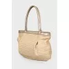 Wicker bag with leather handles