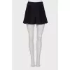 Black pleated shorts