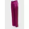 Purple trousers with stripes
