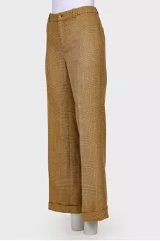 Plaid trousers with golden buttons