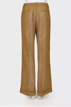 Plaid trousers with golden buttons