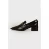 Black loafers with brand logo