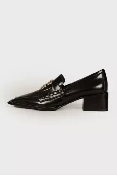 Black loafers with brand logo