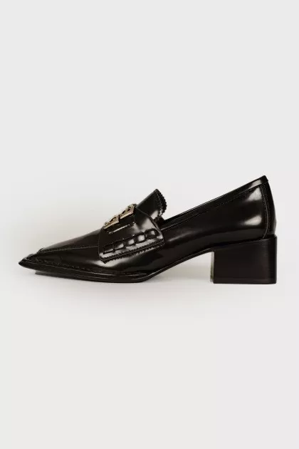 Black loafers with brand logo