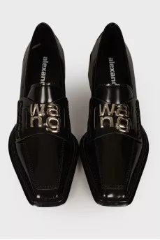 Black loafers with brand logo