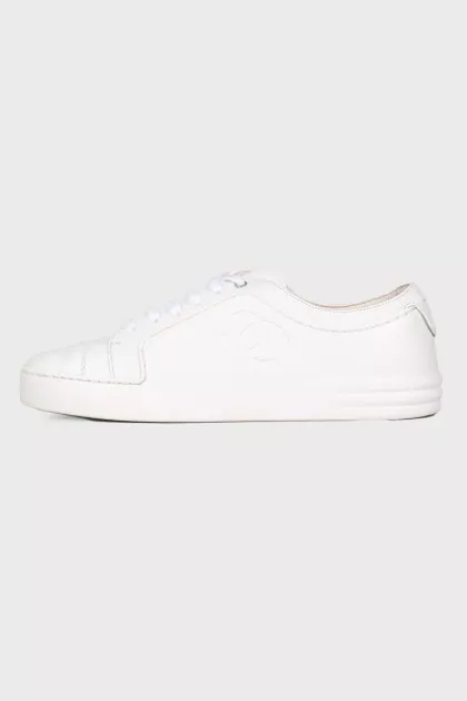 White sneakers with brand logo