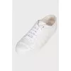 White sneakers with brand logo