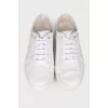 White sneakers with brand logo