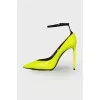 Green heeled shoes with tag