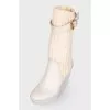 White knitted shin boots