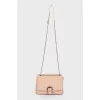 Beige bag with a thin chain strap