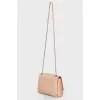 Beige bag with a thin chain strap