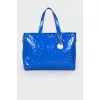 Lacquered blue bag with a metal keyring