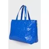Lacquered blue bag with a metal keyring
