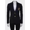 Jacket with golden embroidery on the pocket