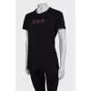Black T-shirt with sequin logo and tag