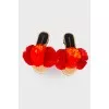 Slippers with red pom-poms