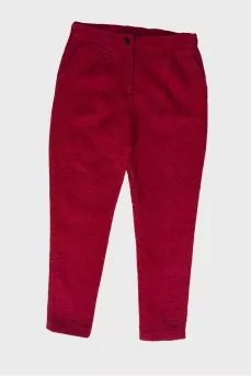 Children's red trousers with a textured pattern