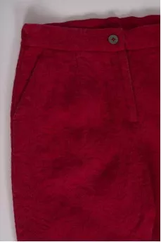 Children's red trousers with a textured pattern
