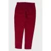 Children's red trousers with a textured pattern