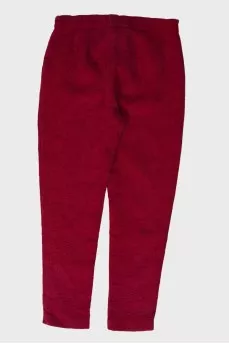 Children's red trousers with a textured pattern