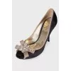 Textile shoes with flower appliqué