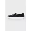 Black slip-ons in soft textile