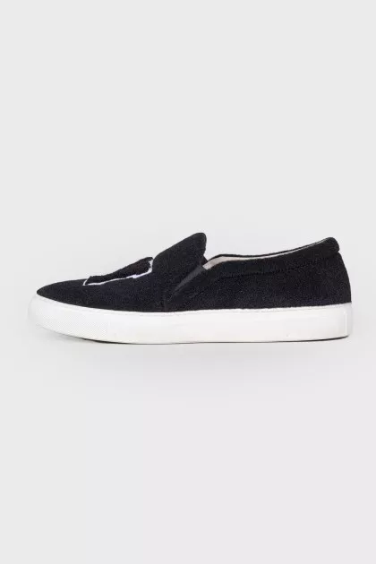 Black slip-ons in soft textile