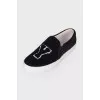 Black slip-ons in soft textile