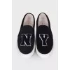 Black slip-ons in soft textile
