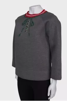 Gray sweatshirt with a decorated collar