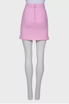 Pink skirt with flower brooches