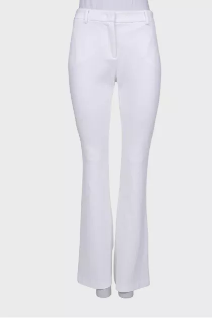 White flared trousers with tag