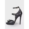 Leather sandals with belt buckles