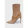 Suede ankle boots with gold chain