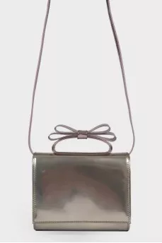 Silver bag with a bow on the handle
