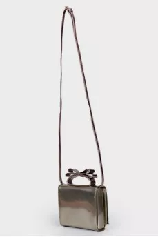Silver bag with a bow on the handle