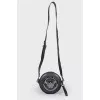 Round bag with metal decoration