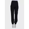 Black trousers with a bow at the waist