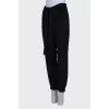 Black trousers with a bow at the waist