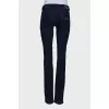 Blue jeans with gold hardware