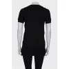 Black tunic with gold fittings