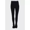 Black trousers with hooks at the bottom