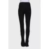 Black trousers with hooks at the bottom