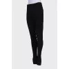 Black trousers with hooks at the bottom