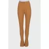 Mustard trousers with hooks at the bottom