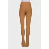 Mustard trousers with hooks at the bottom
