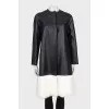 Leather coat with white fur on the hem