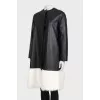 Leather coat with white fur on the hem