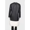 Leather coat with white fur on the hem